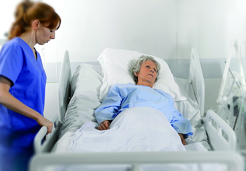 Automated re-positioning of patients in hospital beds